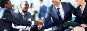 a group of business people shaking hands.