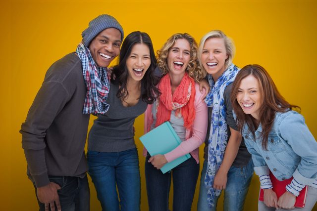 a group of people standing next to each other.