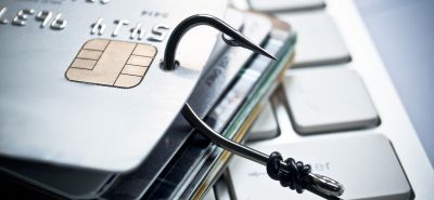 a close up of a credit card on a computer keyboard.
